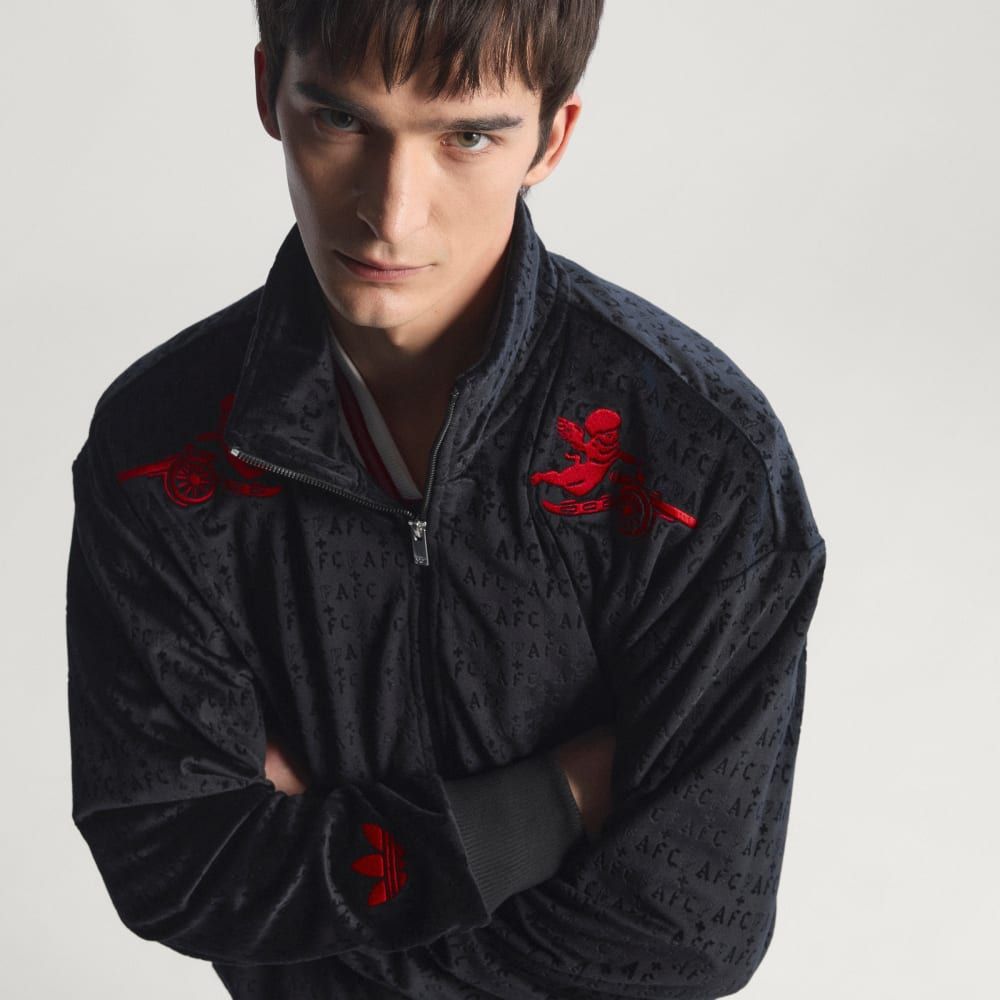 Adidas Arsenal FC Places+Faces Track Top in collaborative colorway, showcasing articulated sleeve construction and tapered fit