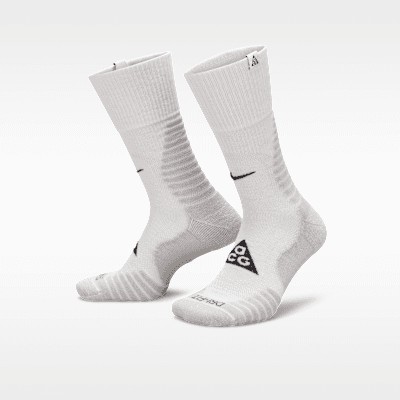 Nike ACG Outdoor Cushioned Crew Socks in Summit White and Light Smoke Grey, displayed as a single pair against neutral background
